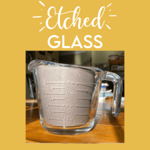 Etched glass tutorial on bartoncraftbarn.com showing how to replace the measurement lines on a faded 2 cup pyrex measuring cup.