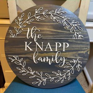 wood family sign made on the glowforge laser cutter with painted letters